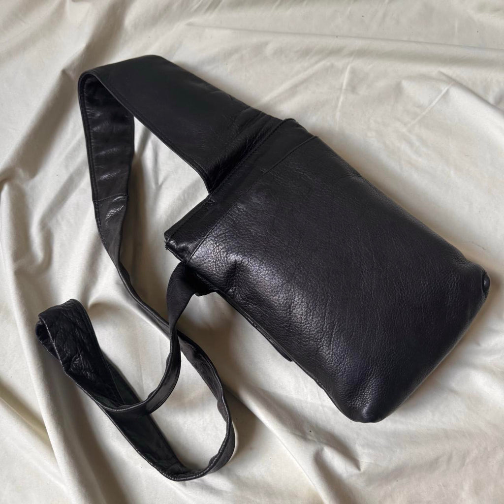 Black leather Y2K crossbody bag with a long strap