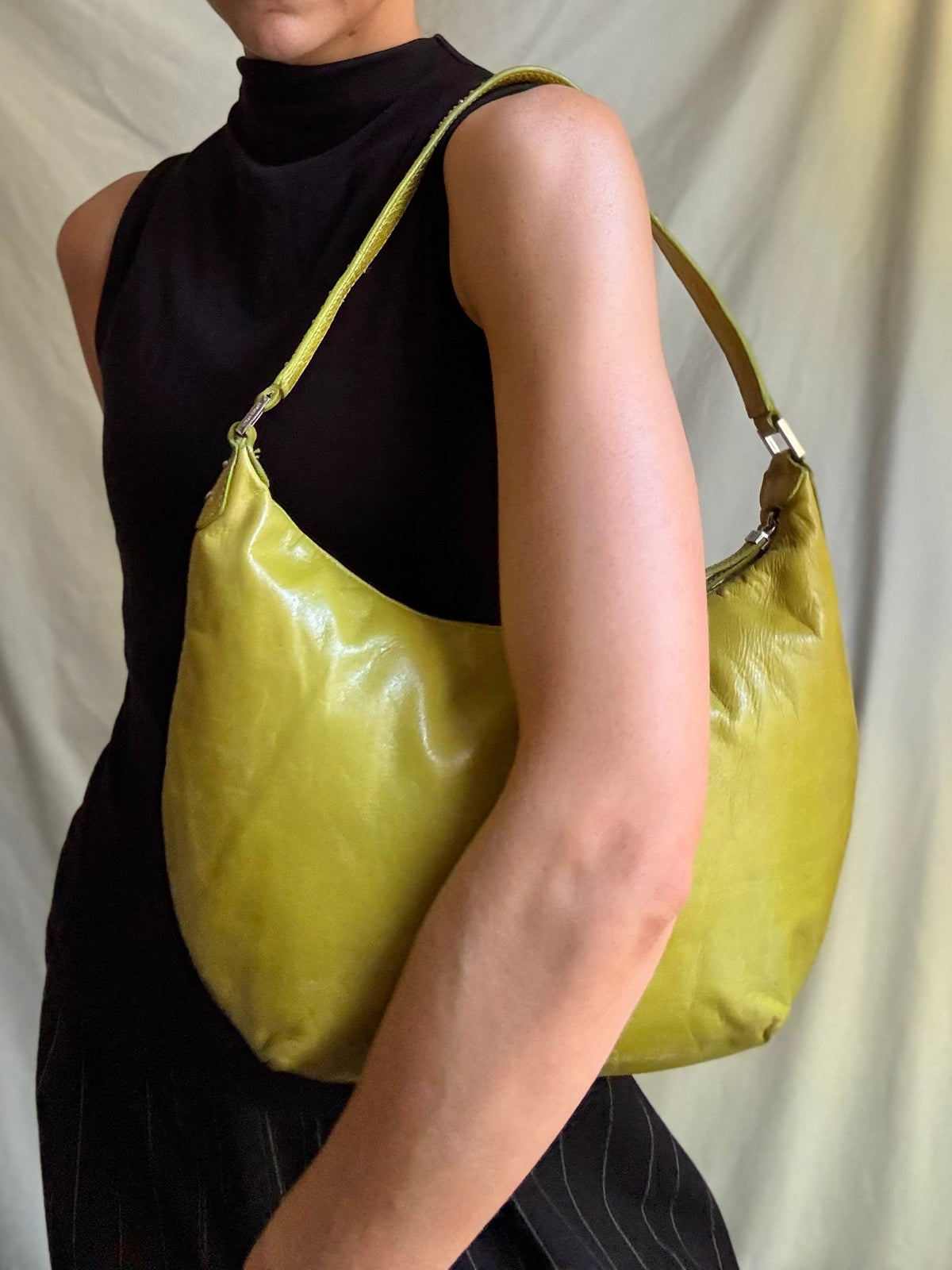 Y2K vintage bright lime green leather rounded, curved hobo bag with decorative studs along the strap 