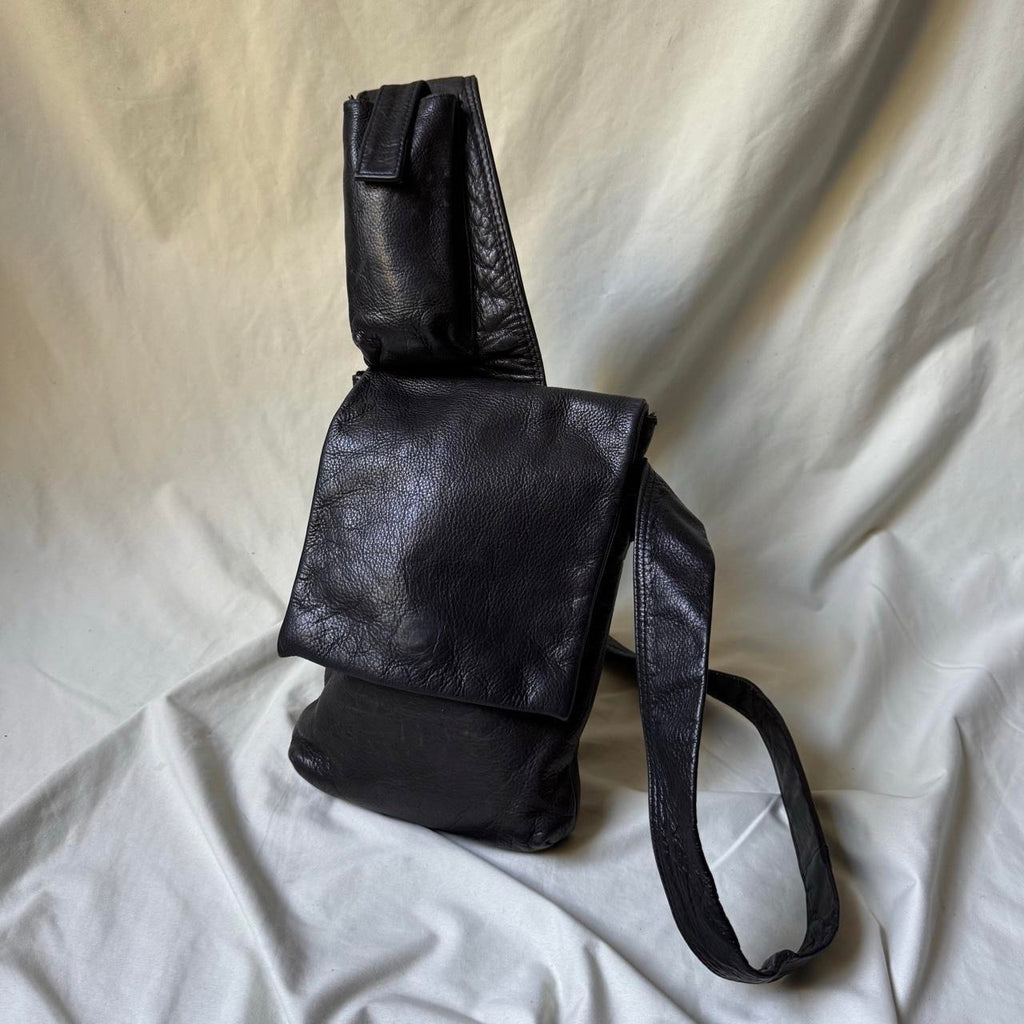 Black leather Y2K crossbody bag with a long strap