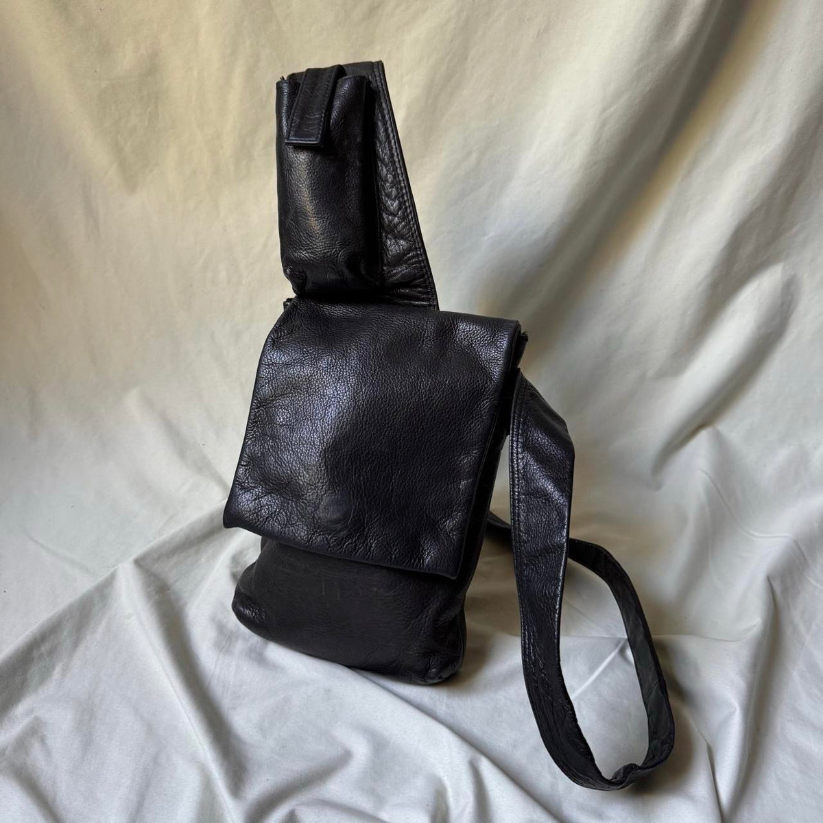 Black leather Y2K crossbody bag with a long strap